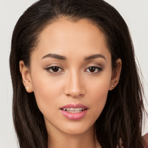 Joyful white young-adult female with long  brown hair and brown eyes