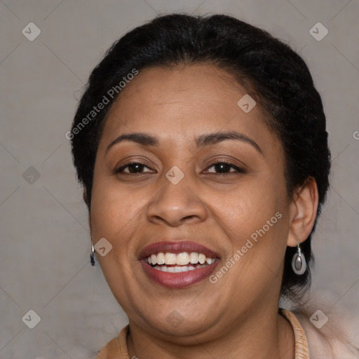 Joyful latino adult female with medium  brown hair and brown eyes