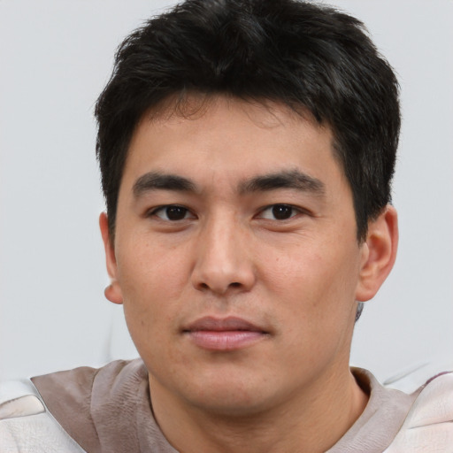 Neutral asian young-adult male with short  brown hair and brown eyes