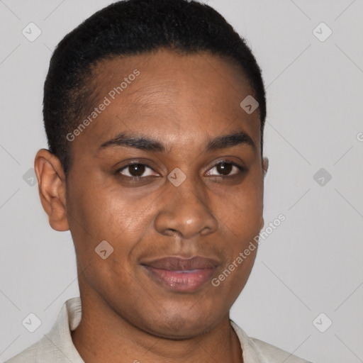 Joyful black young-adult male with short  brown hair and brown eyes