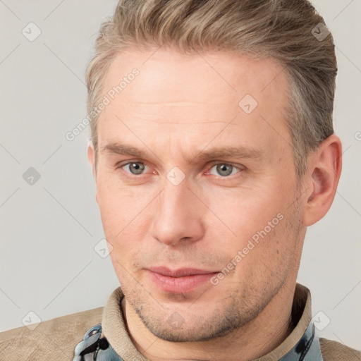 Joyful white adult male with short  brown hair and grey eyes