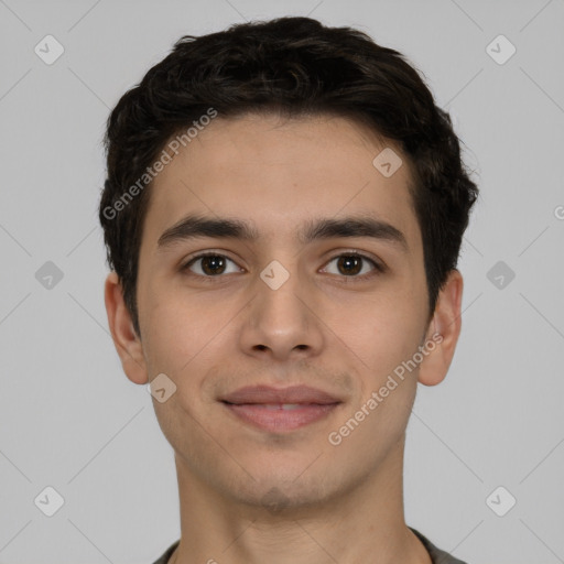 Joyful white young-adult male with short  black hair and brown eyes