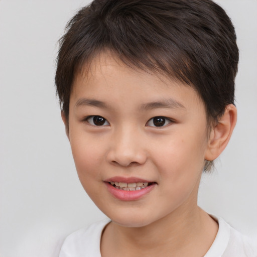 Joyful white child female with short  brown hair and brown eyes