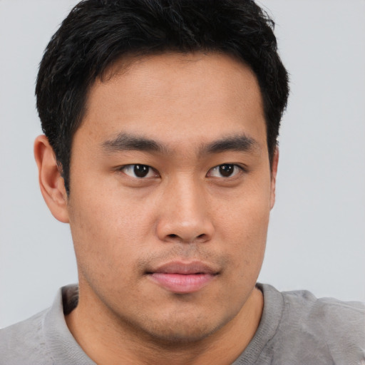 Neutral asian young-adult male with short  brown hair and brown eyes