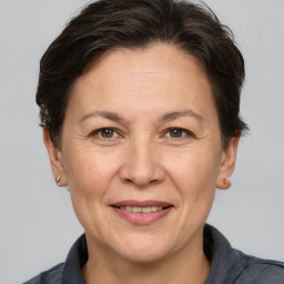 Joyful white adult female with short  brown hair and brown eyes