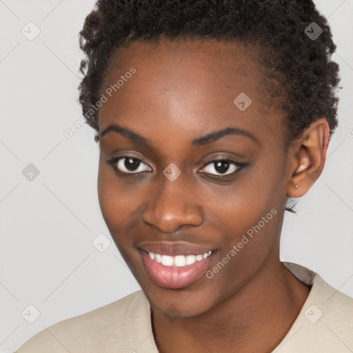 Joyful black young-adult female with short  brown hair and brown eyes