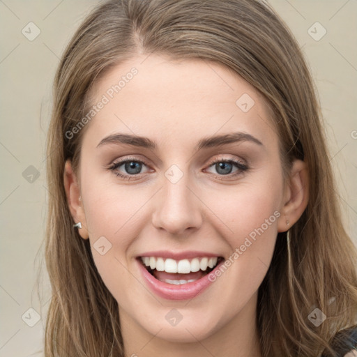 Joyful white young-adult female with long  brown hair and green eyes