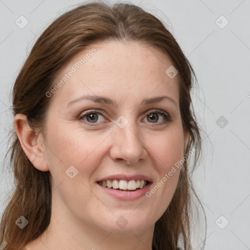 Joyful white young-adult female with long  brown hair and grey eyes