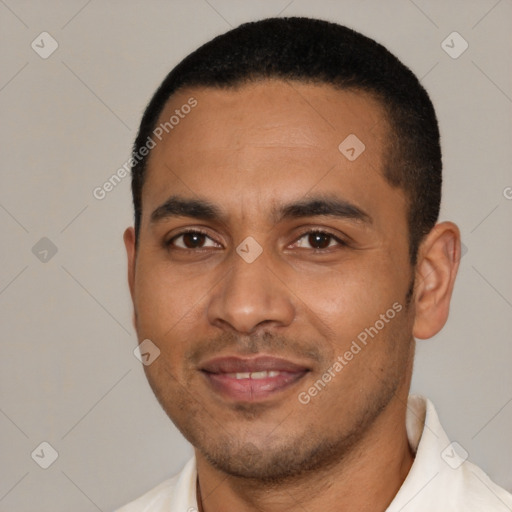 Joyful black young-adult male with short  black hair and brown eyes