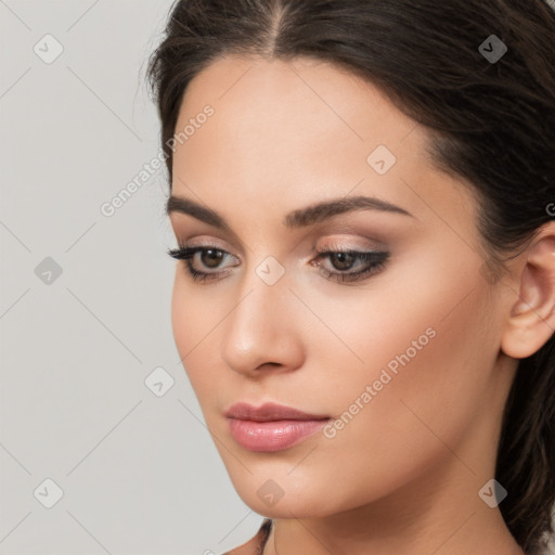 Neutral white young-adult female with long  brown hair and brown eyes