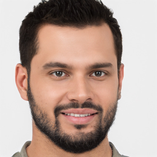 Joyful white young-adult male with short  brown hair and brown eyes