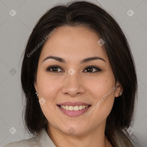 Joyful latino young-adult female with medium  brown hair and brown eyes