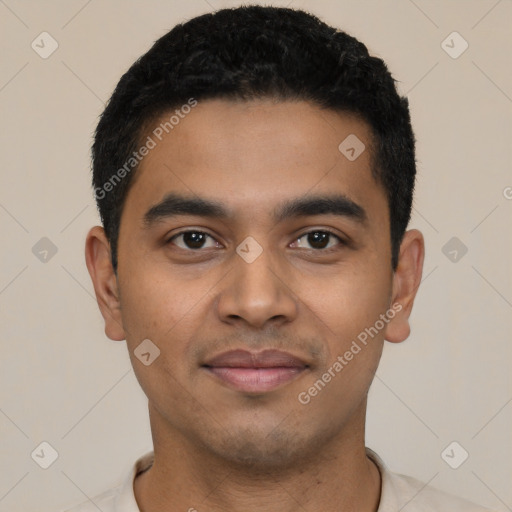 Joyful latino young-adult male with short  black hair and brown eyes