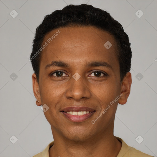 Joyful black young-adult male with short  black hair and brown eyes