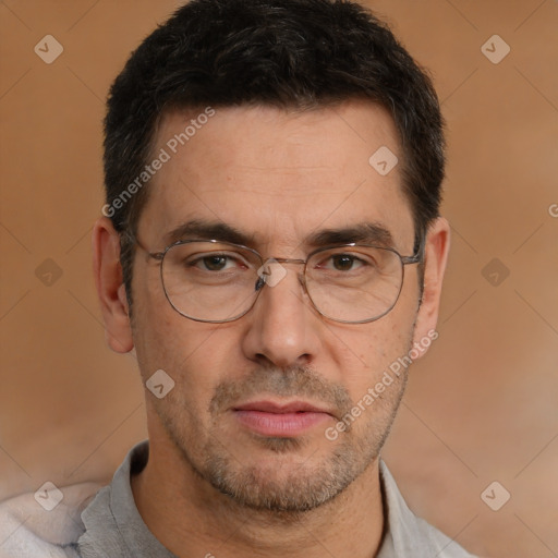 Joyful white adult male with short  brown hair and brown eyes