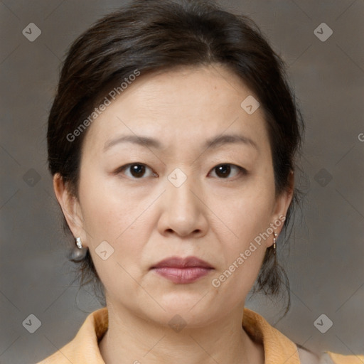 Joyful white adult female with medium  brown hair and brown eyes