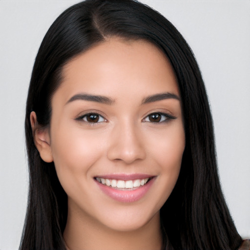 Joyful white young-adult female with long  black hair and brown eyes