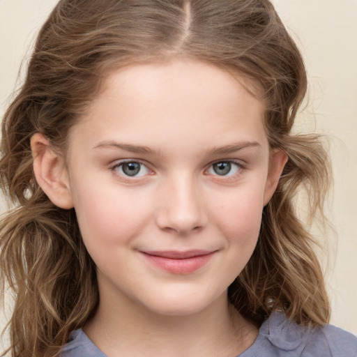 Joyful white child female with medium  brown hair and grey eyes