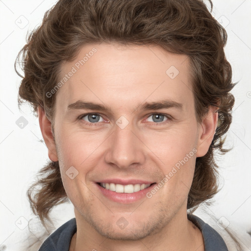 Joyful white young-adult male with medium  brown hair and brown eyes