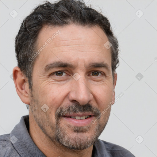 Joyful white middle-aged male with short  brown hair and brown eyes