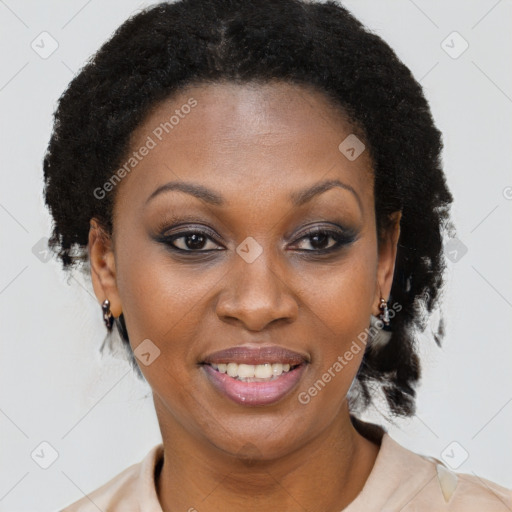 Joyful black adult female with medium  brown hair and brown eyes