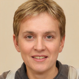 Joyful white adult male with short  brown hair and grey eyes