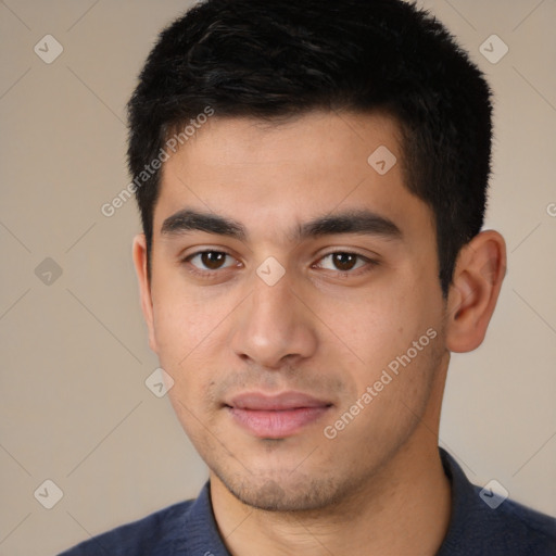 Joyful latino young-adult male with short  black hair and brown eyes