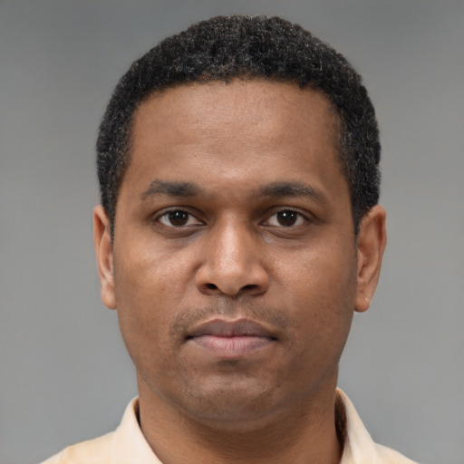 Neutral latino young-adult male with short  brown hair and brown eyes