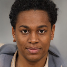 Joyful black young-adult male with short  brown hair and brown eyes