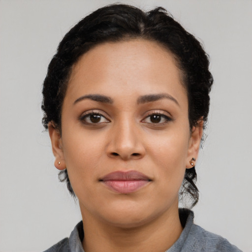 Joyful asian young-adult female with short  black hair and brown eyes