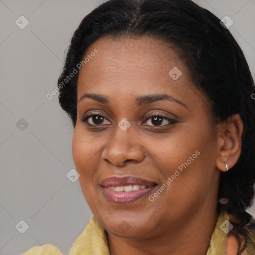 Joyful black young-adult female with medium  brown hair and brown eyes