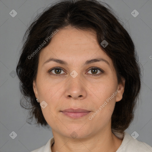 Joyful white adult female with medium  brown hair and brown eyes