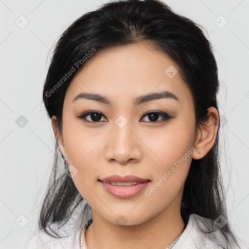 Joyful asian young-adult female with medium  black hair and brown eyes