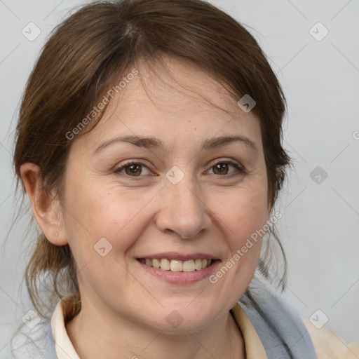 Joyful white adult female with medium  brown hair and brown eyes