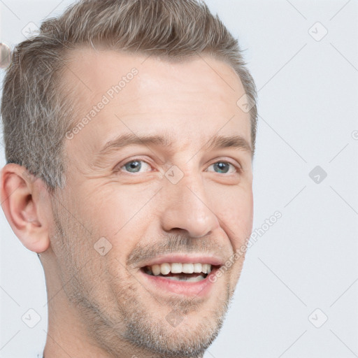 Joyful white adult male with short  brown hair and grey eyes