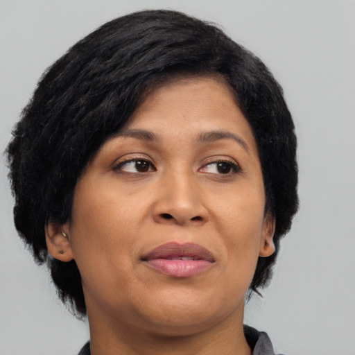 Joyful asian adult female with short  black hair and brown eyes