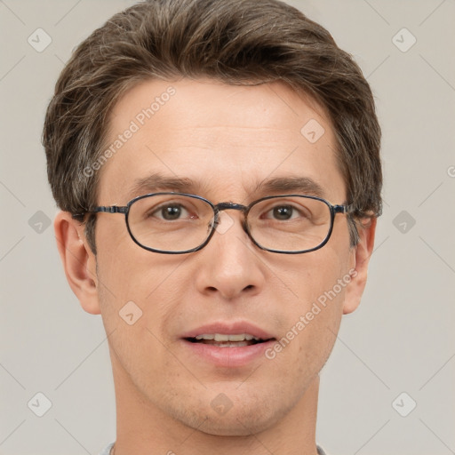 Joyful white adult male with short  brown hair and grey eyes