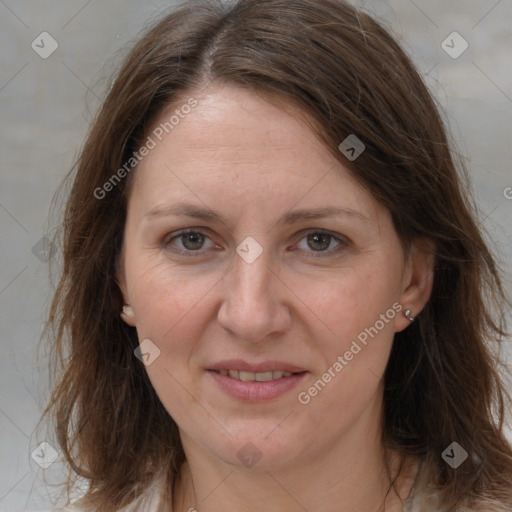 Joyful white adult female with medium  brown hair and grey eyes