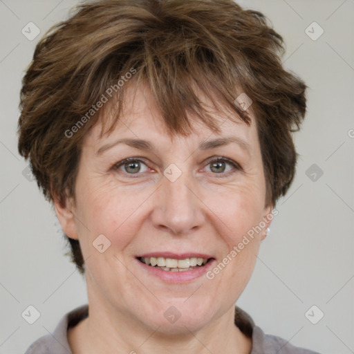 Joyful white adult female with short  brown hair and brown eyes