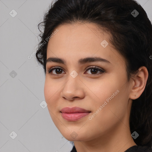 Joyful latino young-adult female with medium  brown hair and brown eyes