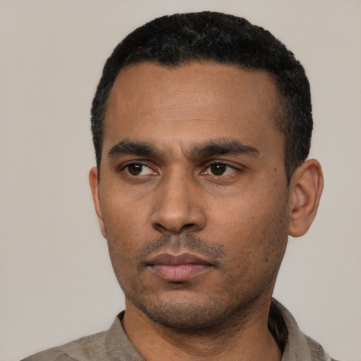 Neutral latino young-adult male with short  black hair and brown eyes