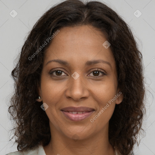 Joyful black adult female with medium  brown hair and brown eyes