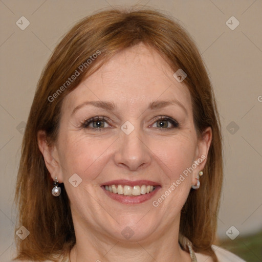 Joyful white adult female with medium  brown hair and grey eyes