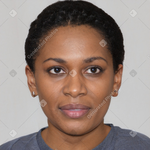 Joyful black young-adult female with short  black hair and brown eyes