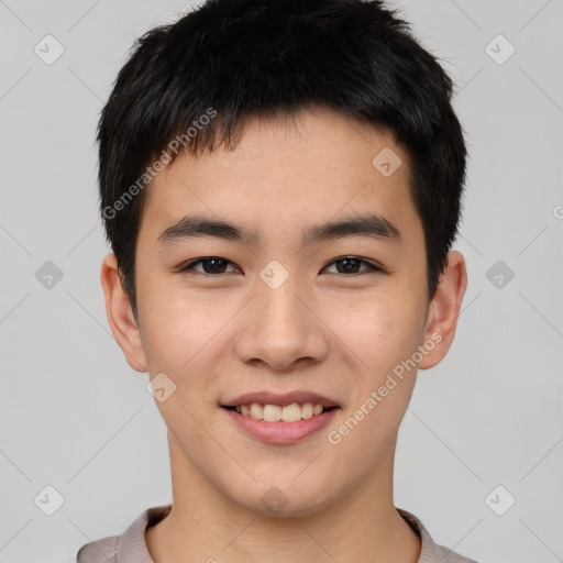 Joyful asian young-adult male with short  brown hair and brown eyes