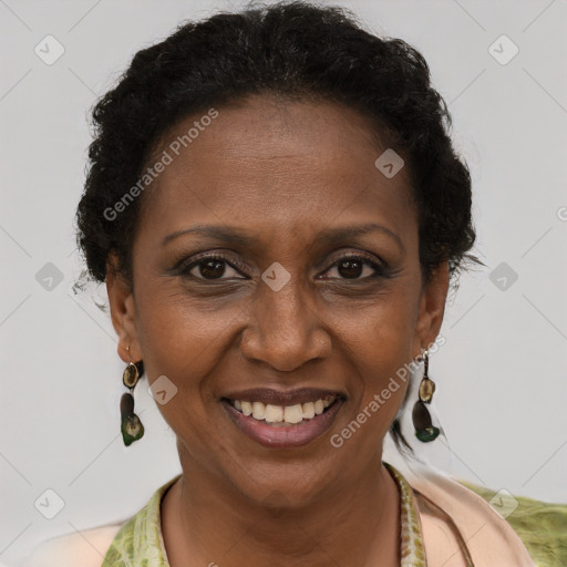 Joyful black adult female with short  brown hair and brown eyes