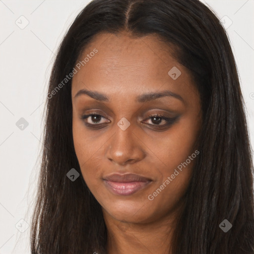 Joyful black young-adult female with long  brown hair and brown eyes