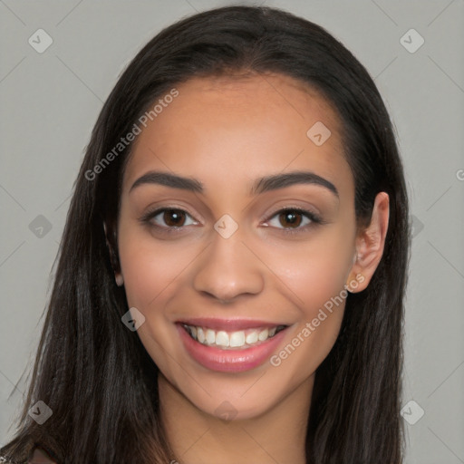 Joyful latino young-adult female with long  brown hair and brown eyes