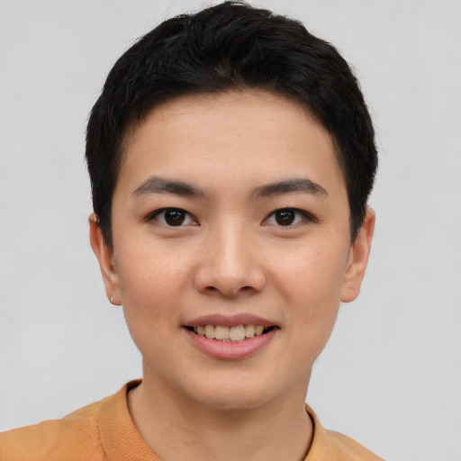 Joyful asian young-adult female with short  black hair and brown eyes
