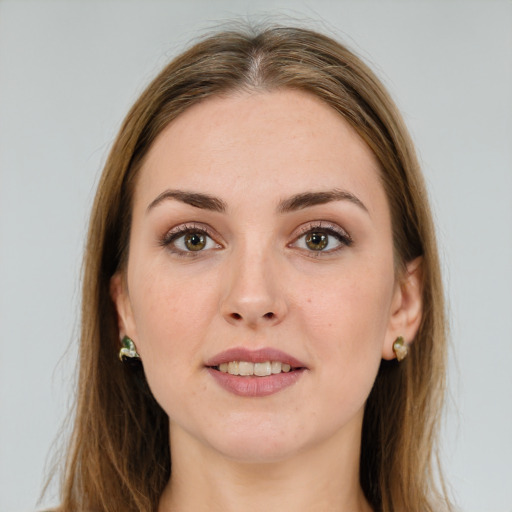 Joyful white young-adult female with long  brown hair and green eyes